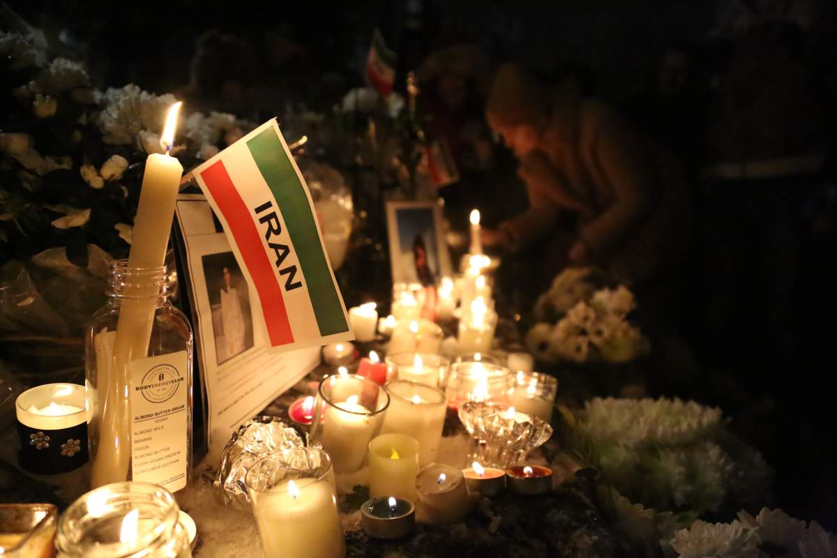 People attend the "Seventh Day Vigil" for Iran plane crash victims at Civic Plaza in front of North Vancouver City Hall, B.C., Canada on January 14, 2020. A candlelight memorial held in honour of people lost aboard Flight 752. 