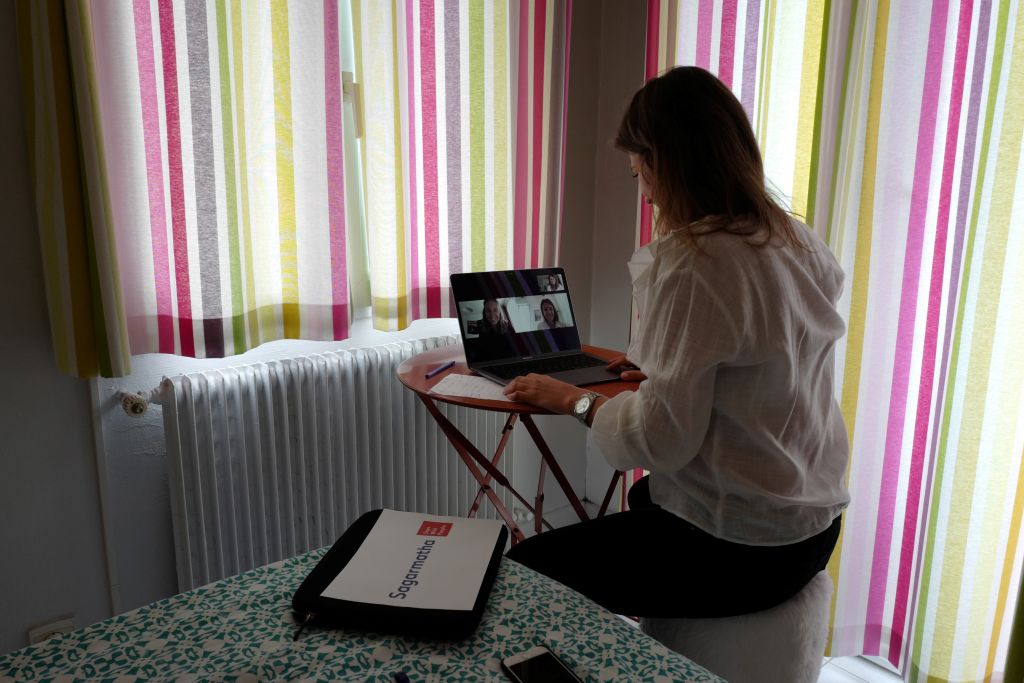 Manon, employee of global PR group Sagarmatha - Hopscotch, connects with her colleagues in Paris via videochat at her home office (teletravail) in the French riviera city of Nice, southern France, on May 15, 2020, a few days after France eased lockdown measures taken to curb the spread of the COVID-19 pandemic, caused by the novel coronavirus. (Photo by VALERY HACHE / AFP) (Photo by VALERY HACHE/AFP via Getty Images).