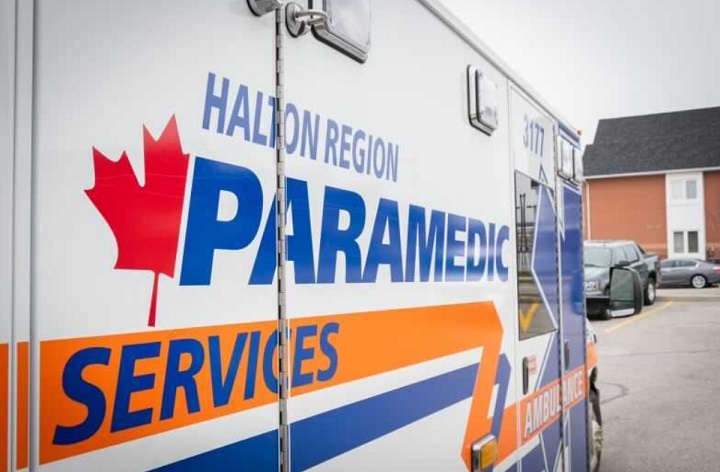 A Halton Region Paramedic Services ambulance is seen in Oakville. Halton Regional Police Service has laid charges against a member of the Oakville Fire Department after an on-duty incident early Sunday involving Halton EMS staff.