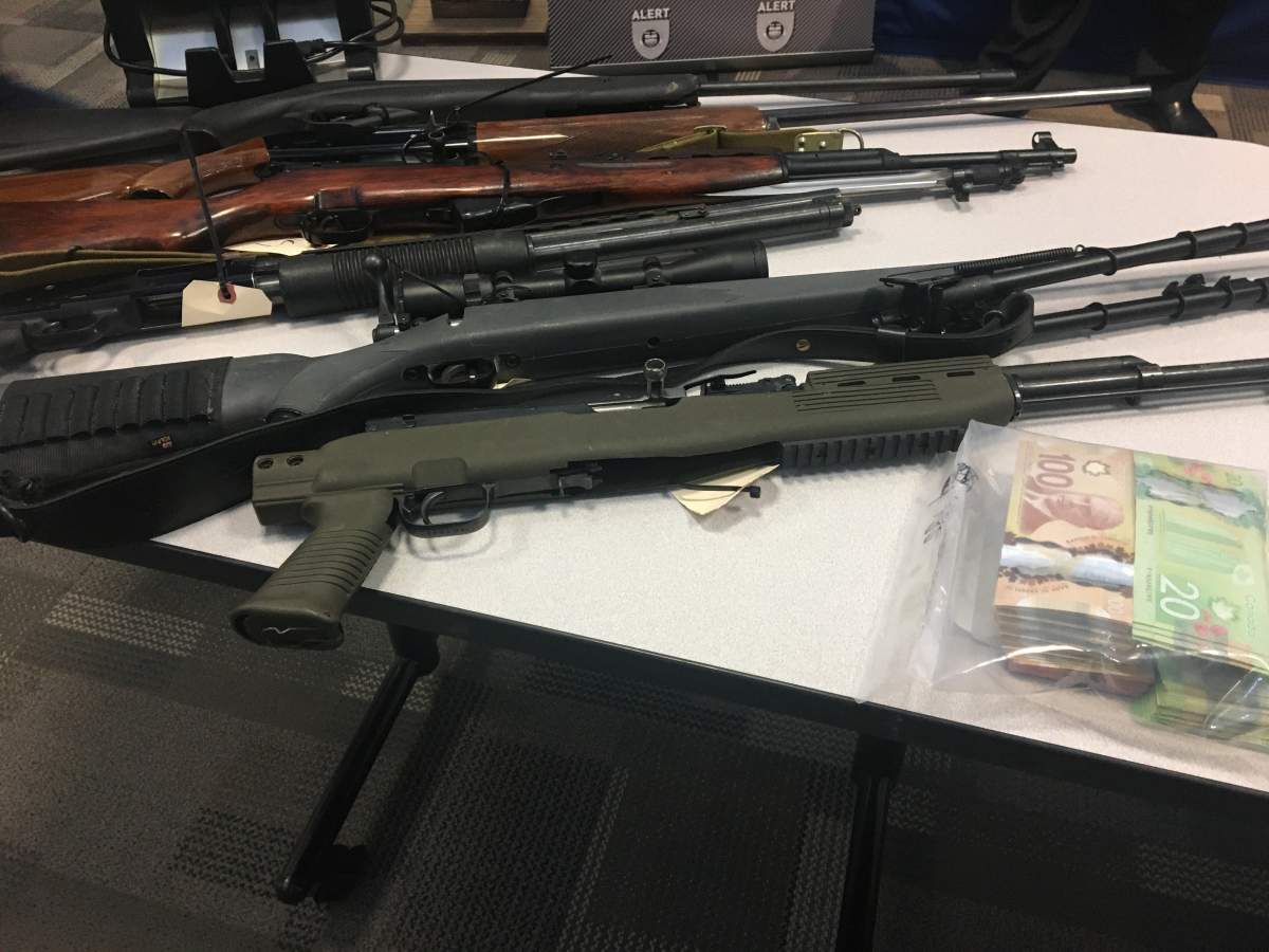 Firearms, drugs, cash, vehicles seized in Lethbridge drug trafficking investigation - image