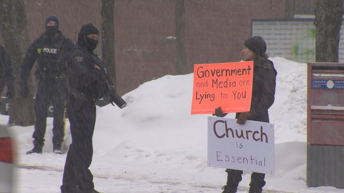 A protestor is seen at an anti-mask rally outside of city hall in Moncton, N.B.