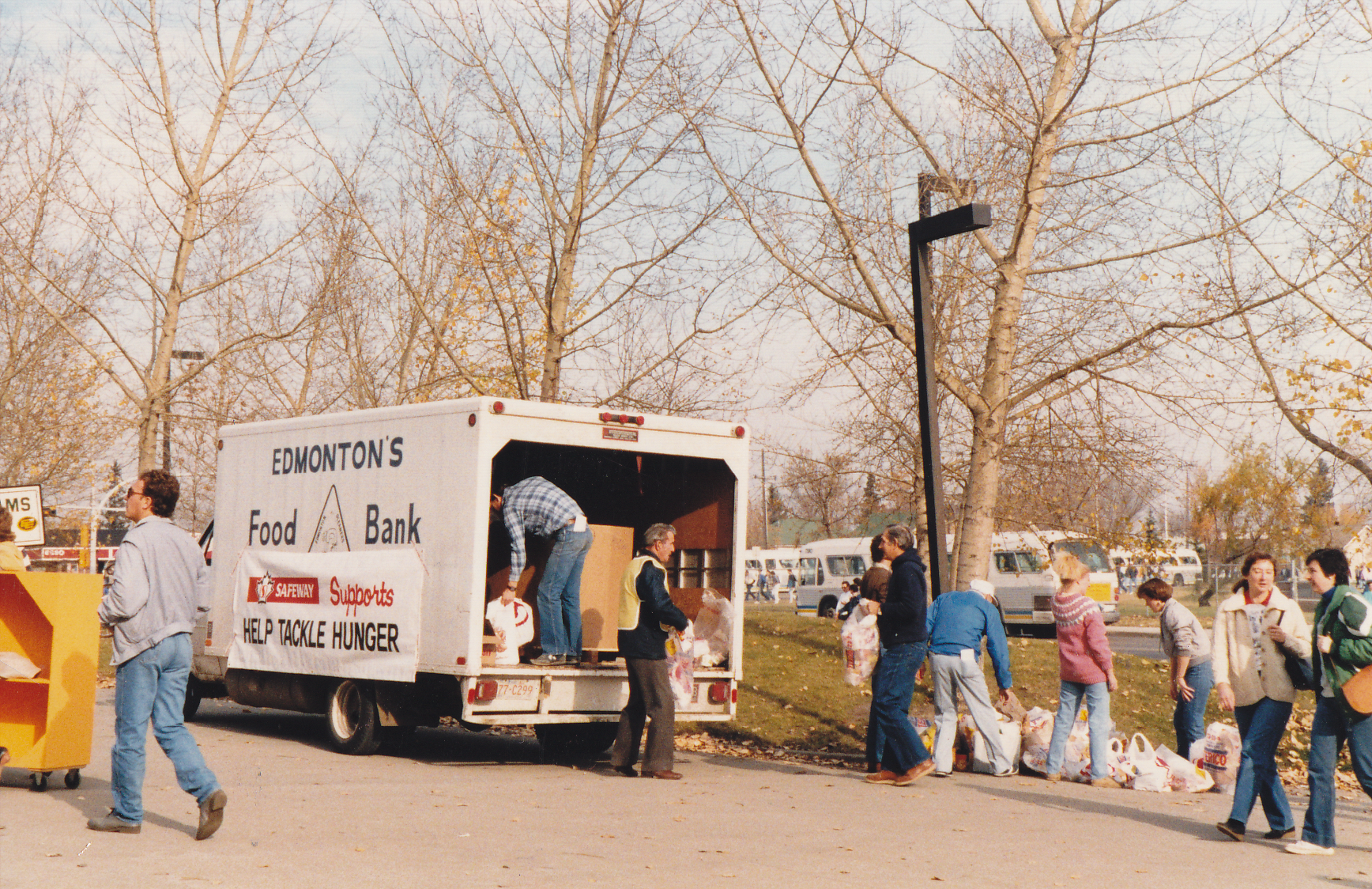 Edmonton\’s Food Bank volunteers load up a vehicle in the mid 80s.
