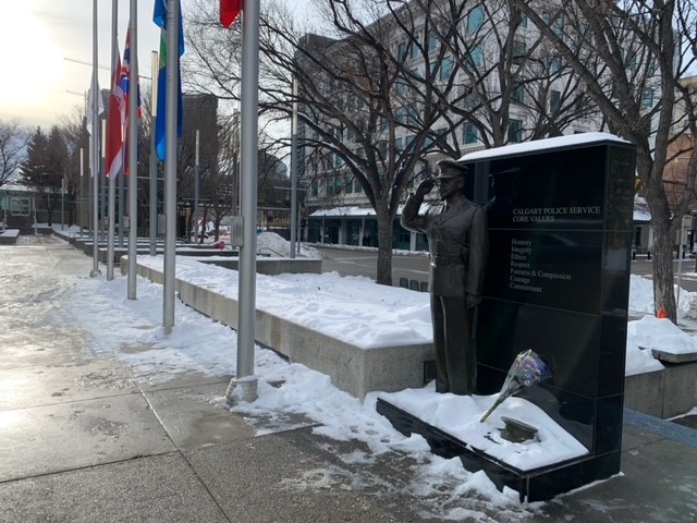 Flowers set up at the Calgary police memorial.