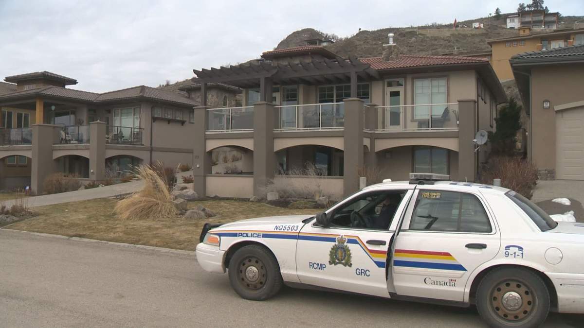 RCMP outside Heather Barker's Cordon Place home after her death in March 2018. 