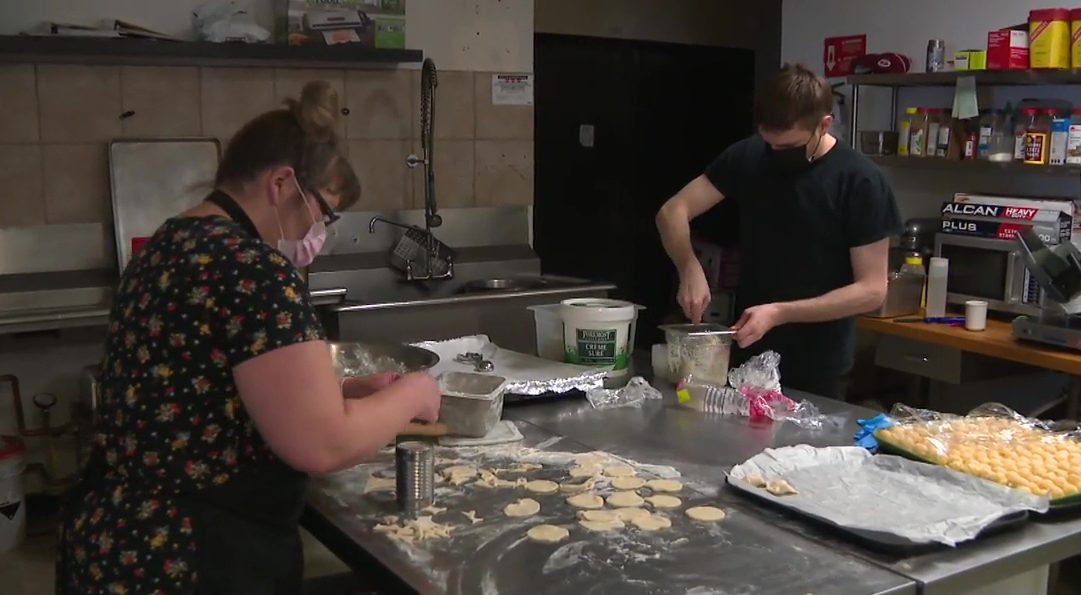 Staff prepping food at Saskitoba Diner in Nisku, Alta. on January 28, 2021.
