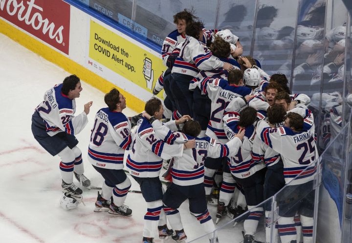 United States celebrate their win over Canada in IIHF World Junior Hockey Championship gold medal game action in Edmonton on Tuesday, January 5, 2021. 