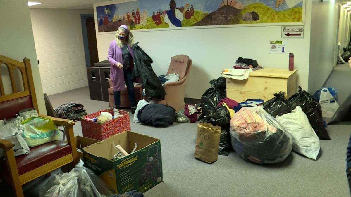 Volunteers sort through donated goods