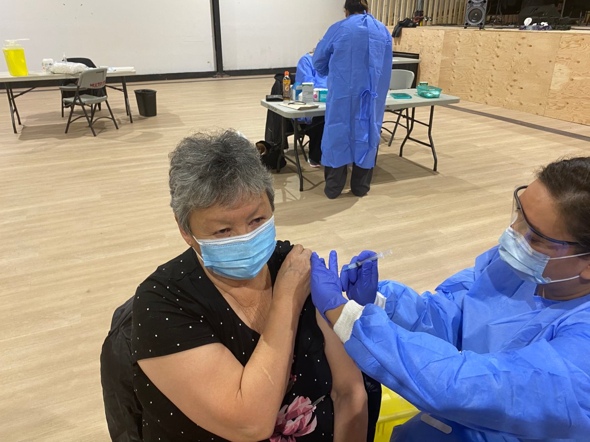 A community member in Norway House Cree Nation receives one of the first 240 doses of the Moderna vaccine, which arrived on January 7, 2021.