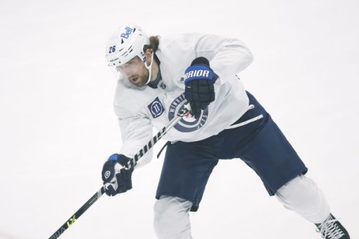 Winnipeg Jets’ Blake Wheeler (26) shoots during the first day of their NHL training camp in Winnipeg, Monday, January 4, 2021.