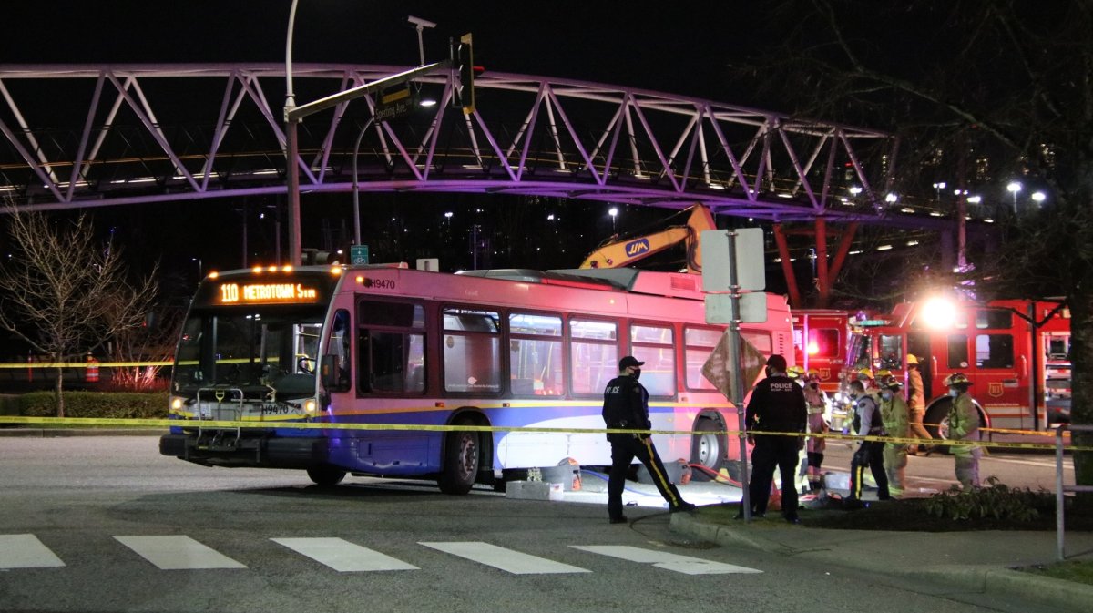 Police and emergency crews attempting to extract a male pedestrian from underneath a transit bus after he was struck by the vehicle Wednesday night.