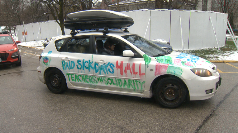 Teachers with Education Workers United decorated their vehicles and drove around Queen's Park Saturday, demanding the province provide financial support for families during school closures. 