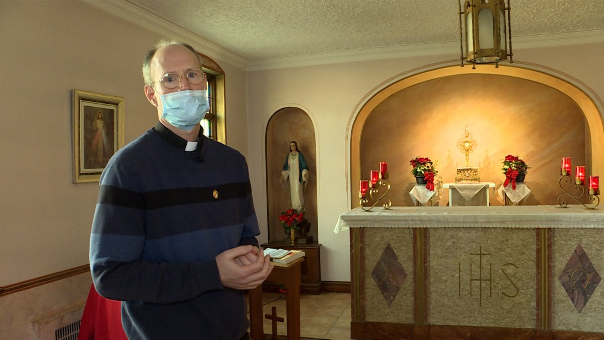 Fr. Mark Ruckpaul stands in the Adoration chapel at St. Michael the Archangel Catholic Church.
