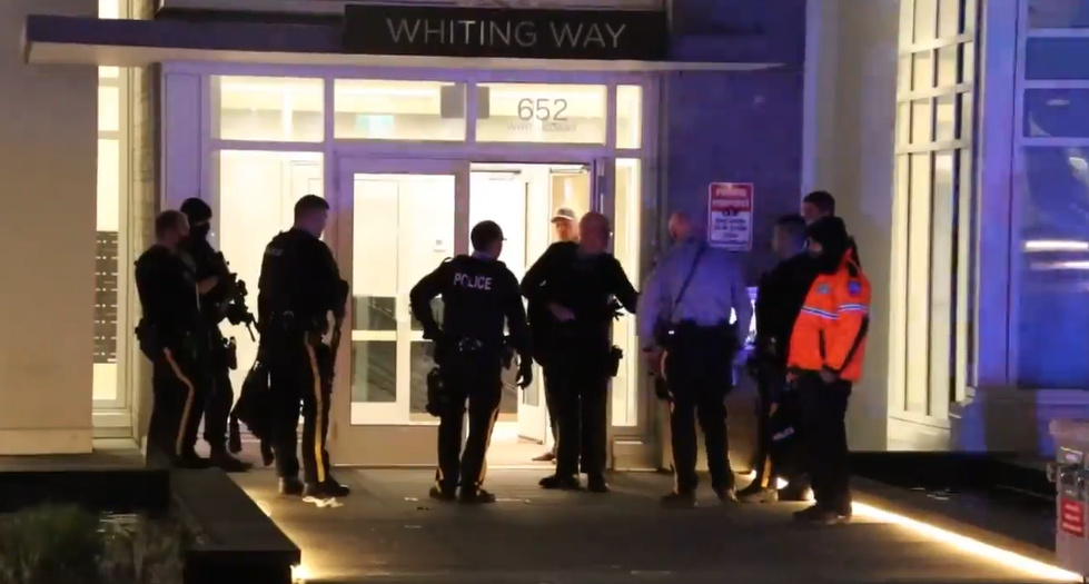 Police respond to what neighbours say was a shooting in a Coquitlam apartment building overnight.