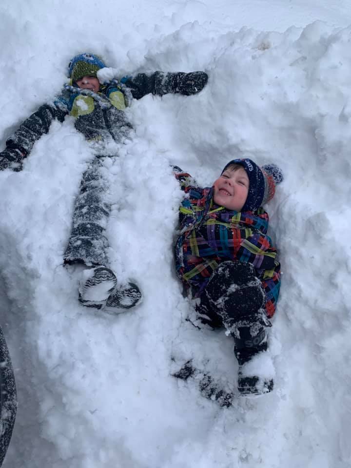 Jonny and Charlie Buchko of London playing in the snow.