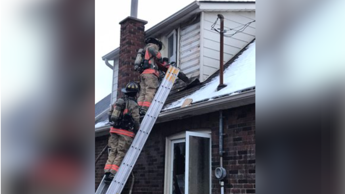 Firefighters attempt to put down a multiple-alarm structure fire at 115 Crosthwaite Ave. S. in East Hamilton on Jan. 29, 2021.