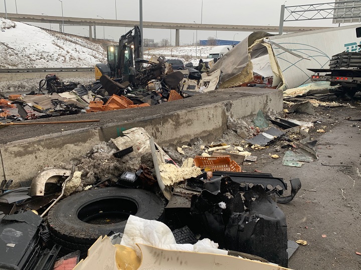 A photo of the cleanup efforts following a crash involving two transport trucks on Highway 401 in Toronto.
