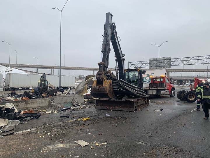 A photo of the cleanup efforts following a crash involving two transport trucks on Highway 401 in Toronto.