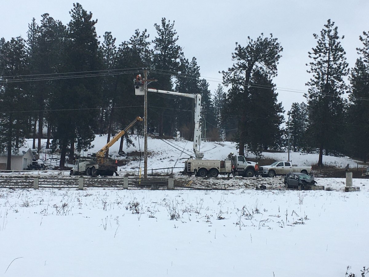 Utility repair crews fixing a power outage that was caused by a crash near Highway 97 and Westside Rd. 