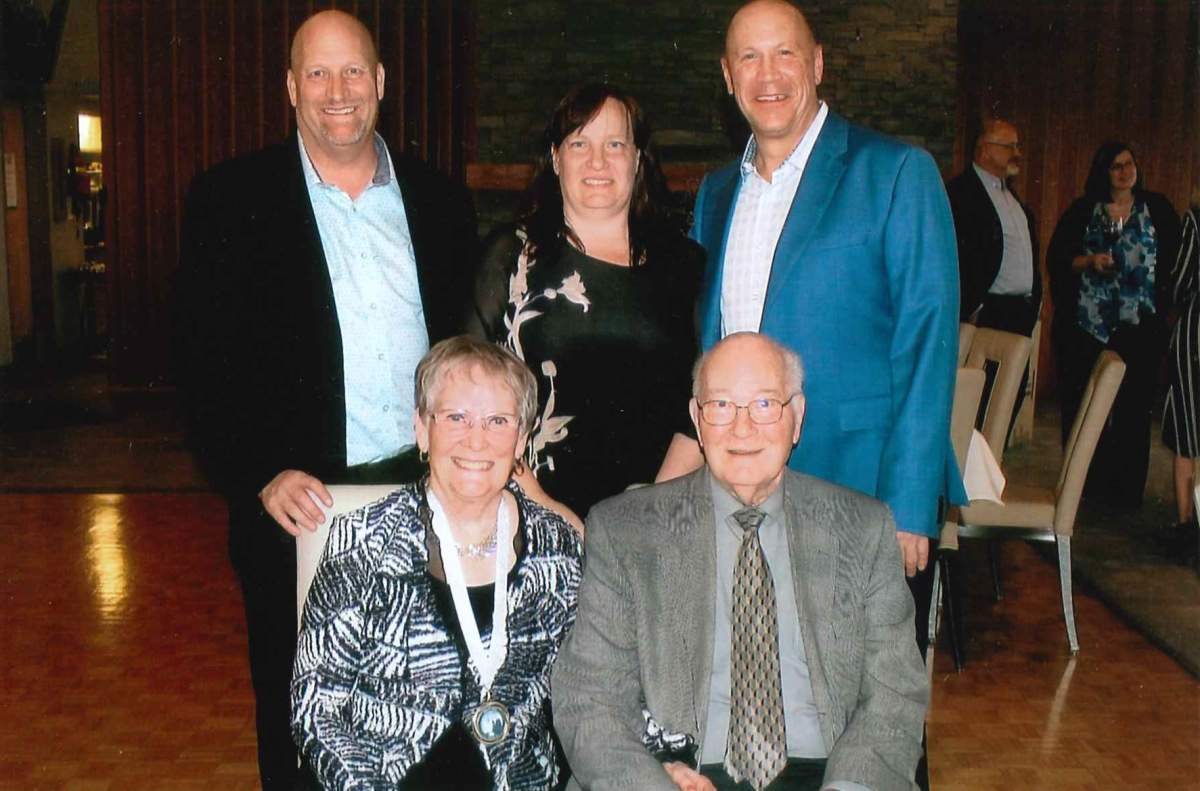 A photo of Jan and Al Davey (sitting) with loved ones.