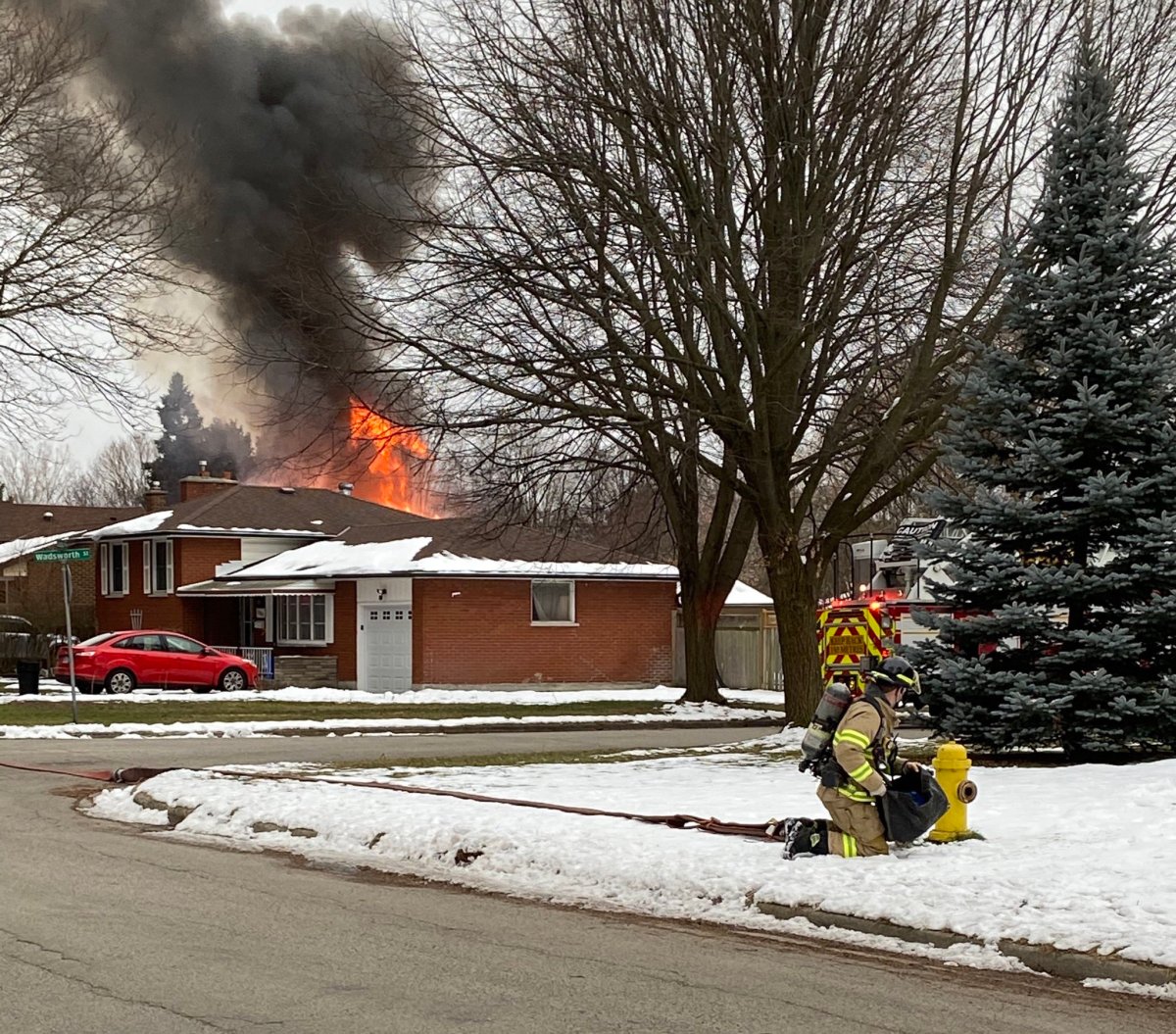 Firefighters in London, Ont., respond to a garage fire in the city's Huron Heights neighbourhood on Monday.