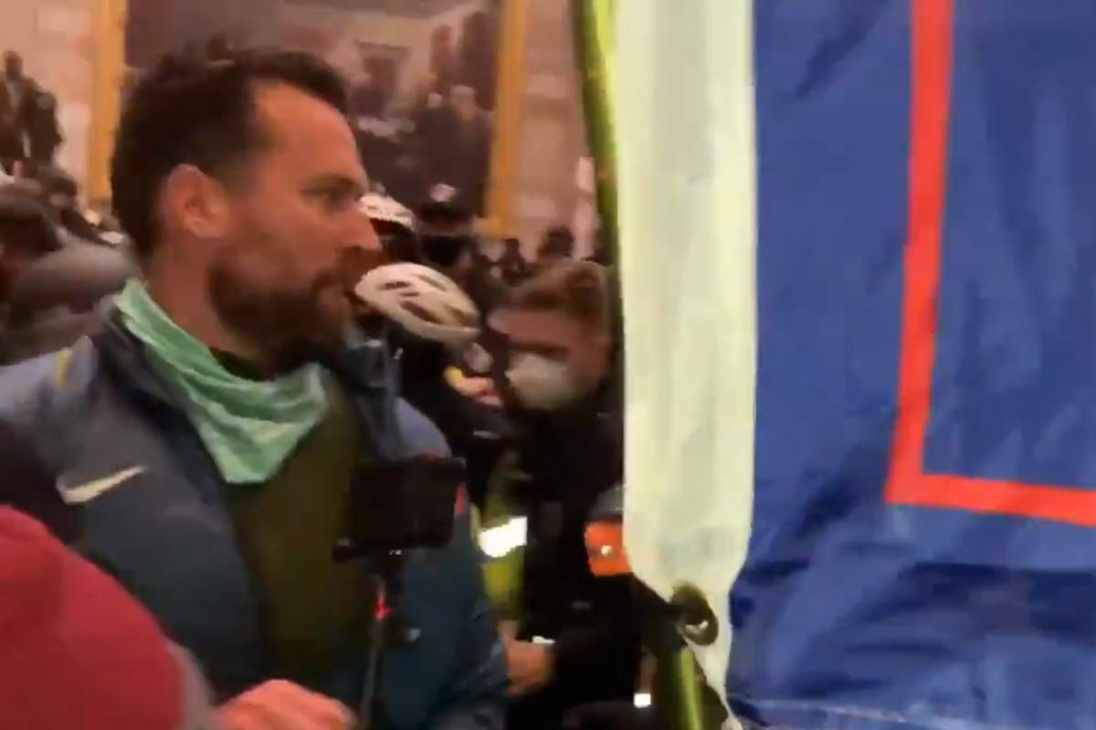A man identified by friends and teammates as Klete Keller is shown in a Team USA Olympic jacket at the U.S. Capitol during a pro-Trump riot on Jan. 6, 2021.