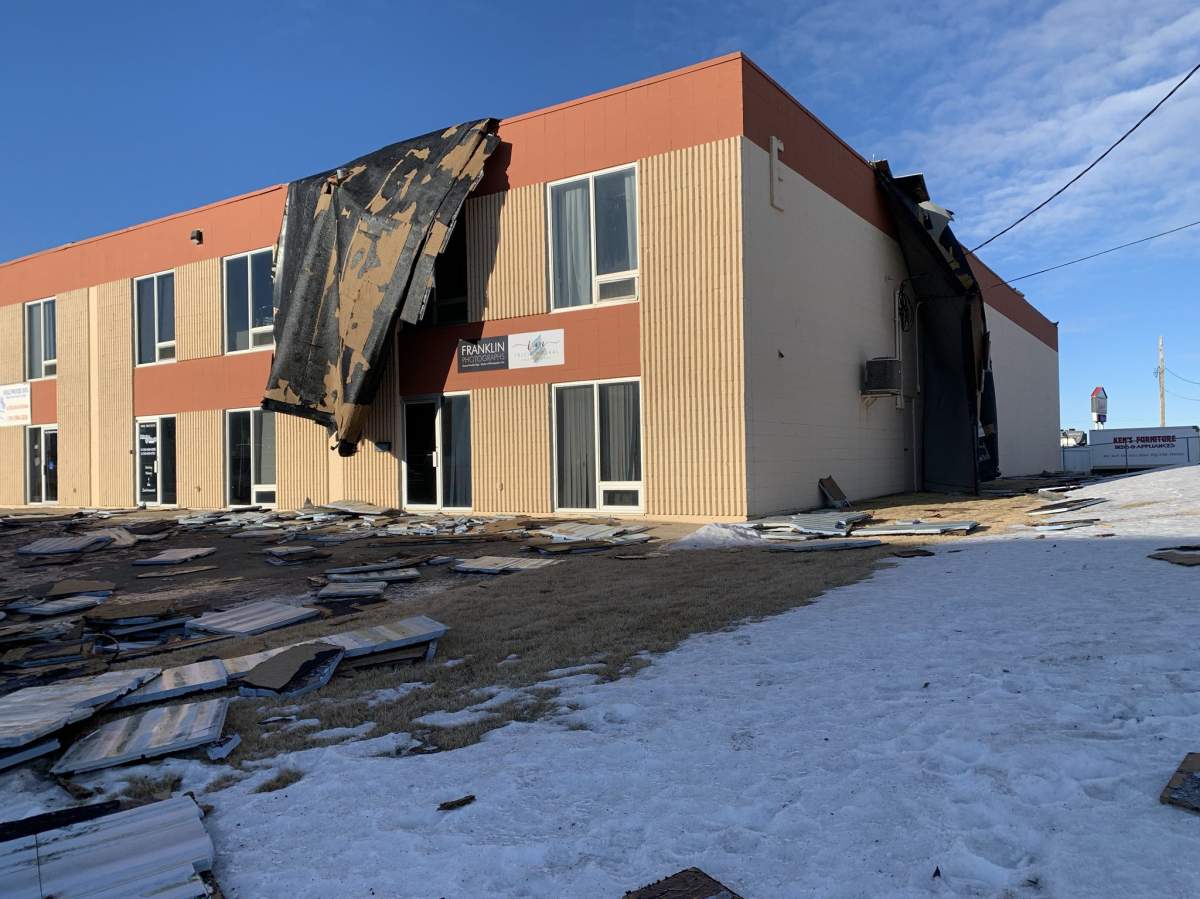 A strip mall in Leduc had part of its roof ripped off by intense winds the evening of Tuesday, Jan. 19, 2021.
