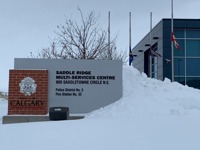 Flags are seen lowered at the Calgary Police Service istrict 5 building, commemorating the life of Sgt. Andrew Harnett, who died after being hit during a traffic stop on New Year’s Eve.