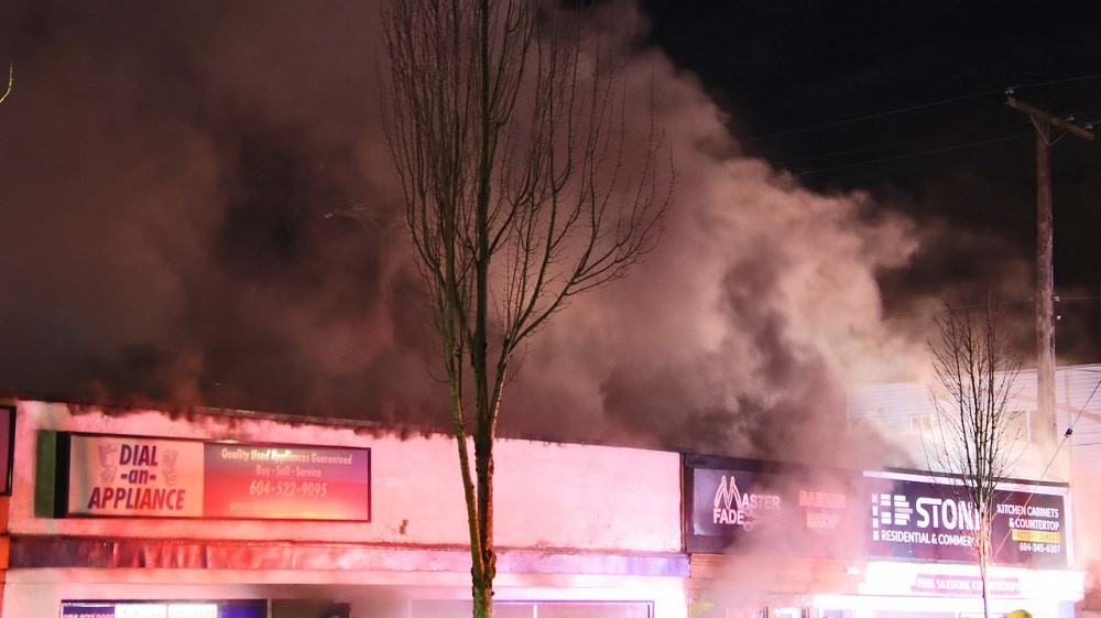 Fire damages stores in New Westminster Friday morning. Credit: Shane MacKichan.