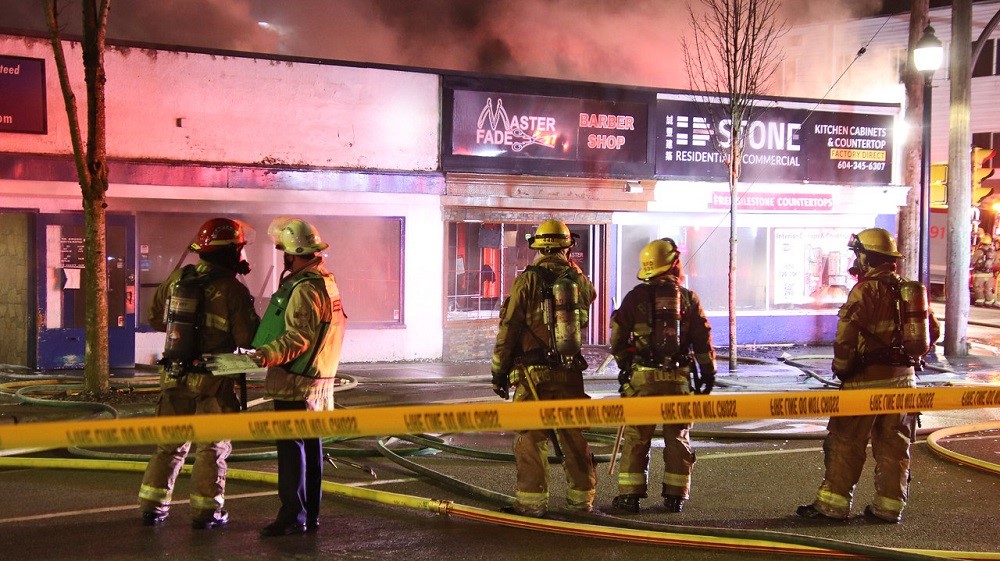 Fire damages stores in New Westminster Friday morning. Credit: Shane MacKichan.