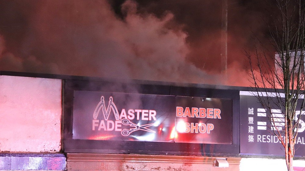 Fire damages stores in New Westminster Friday morning. Credit: Shane MacKichan.