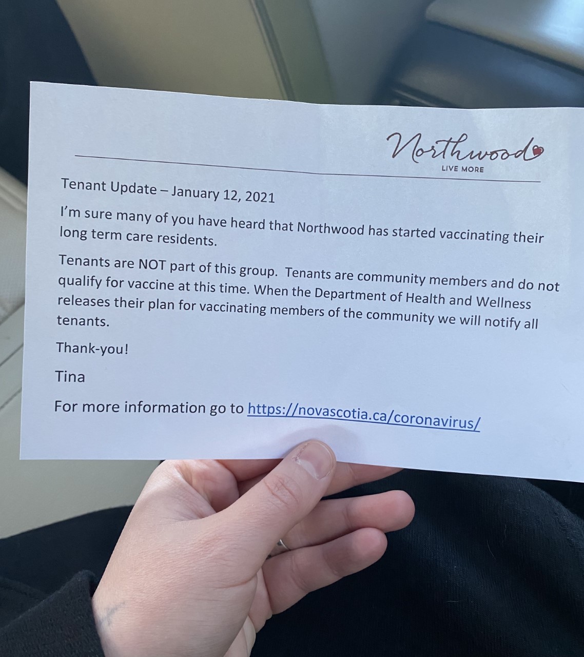 Kat Cochrane holds the notice they received from Northwood Halifax explaining that residential tenants will have to wait a while longer to get the COVID-19 vaccine.