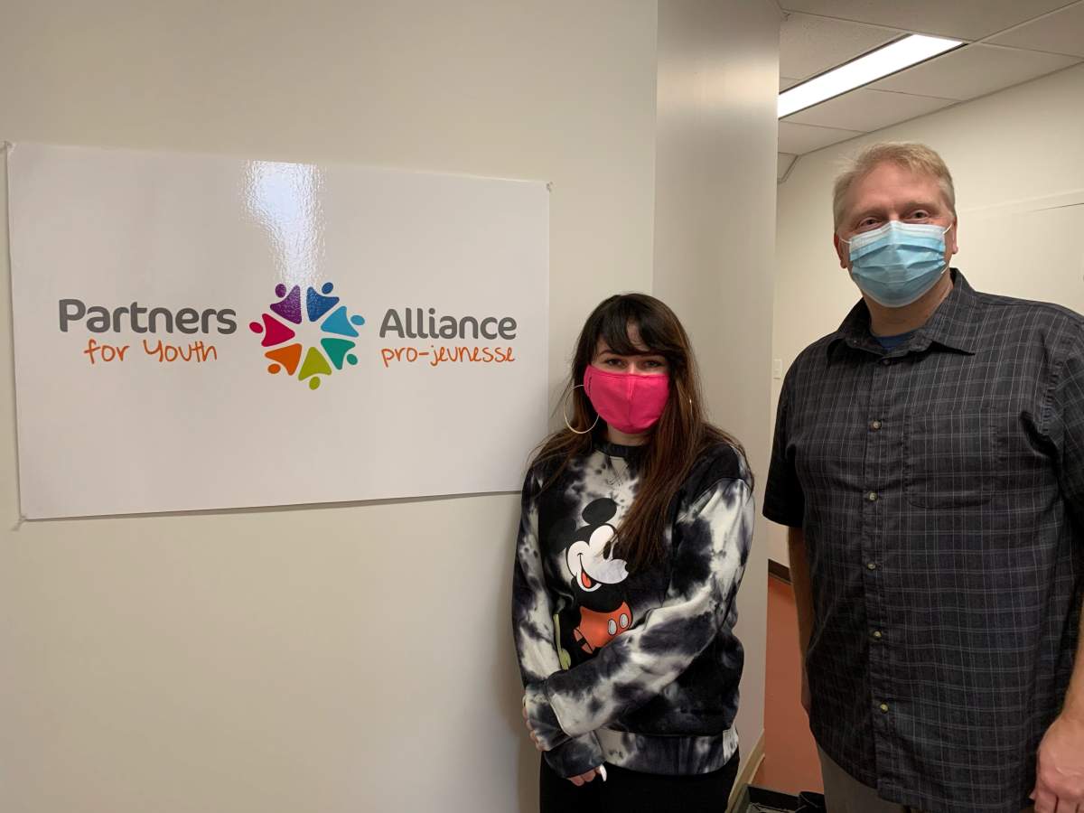 Partners for Youth Coordinator, Zoe Bourgeois, and Executive Director John Sharpe. 