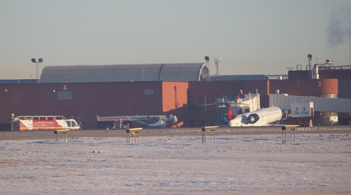 Air Canada flights from Regina to Vancouver and Toronto were delayed Friday morning after a catering truck got stuck under the nose of a CRJ900 aircraft at the Regina airport.