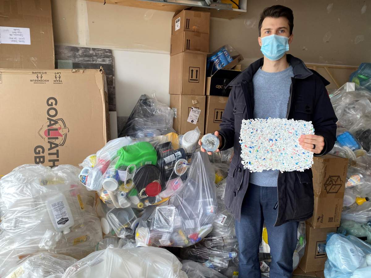 Corey Saban of [Re] Waste poses for a photo in his garage on January 6, 2021