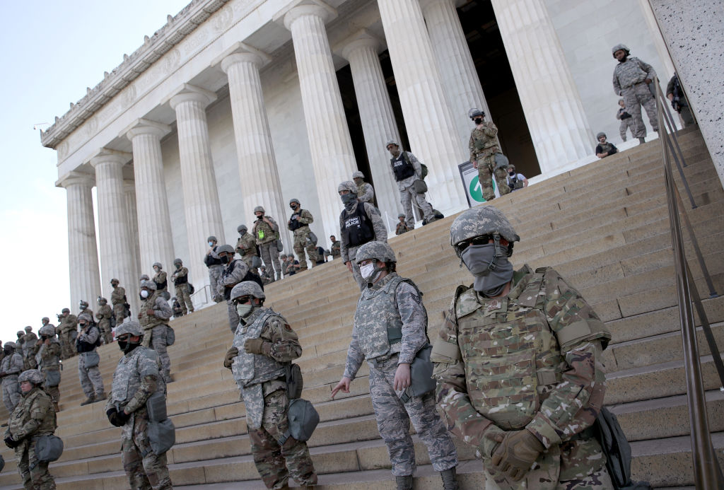 Members of the D.C. National Guard stand on the steps of the Lincoln Memorial as demonstrators participate in a peaceful protest against police brutality and the death of George Floyd, on June 2, 2020, in Washington, D.C.
