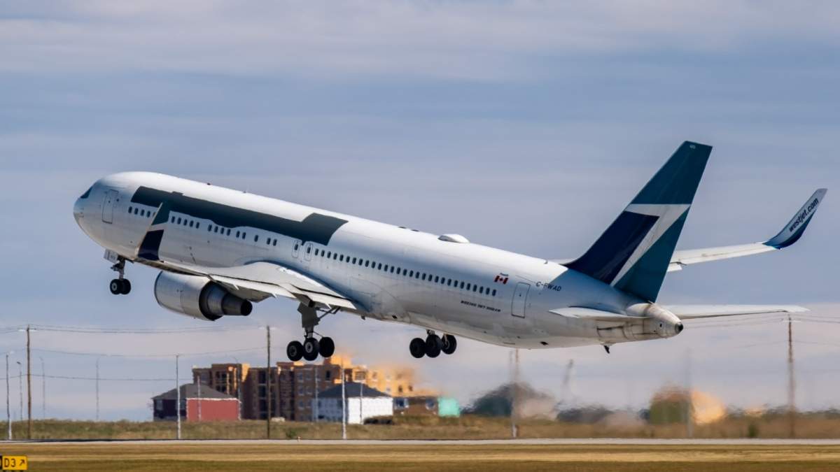 A former WestJet Boeing 767-300 takes off from Calgary's airport on Sept. 8, 2020 after being bought by Amazon.