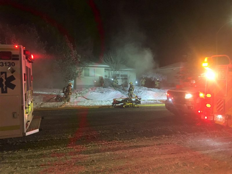 Firefighters respond to a home in the 10700 block of Elbow Drive Southwest on Tuesday, Feb. 23, 2021.