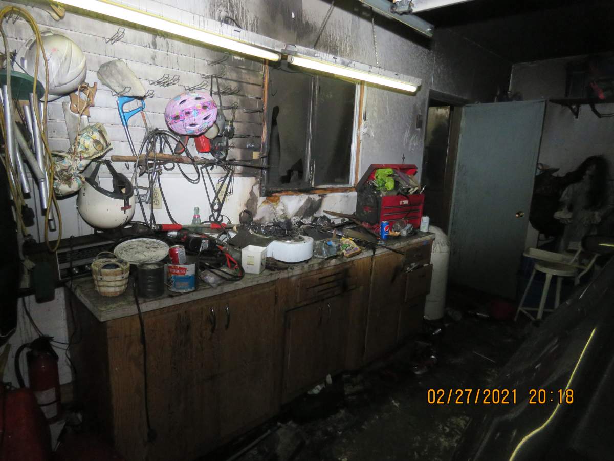 Saskatoon fire crews discovered smoke coming out of the roof of garage in the Dundonald neighbourhood on Saturday evening while investigating an extinguished fire. 