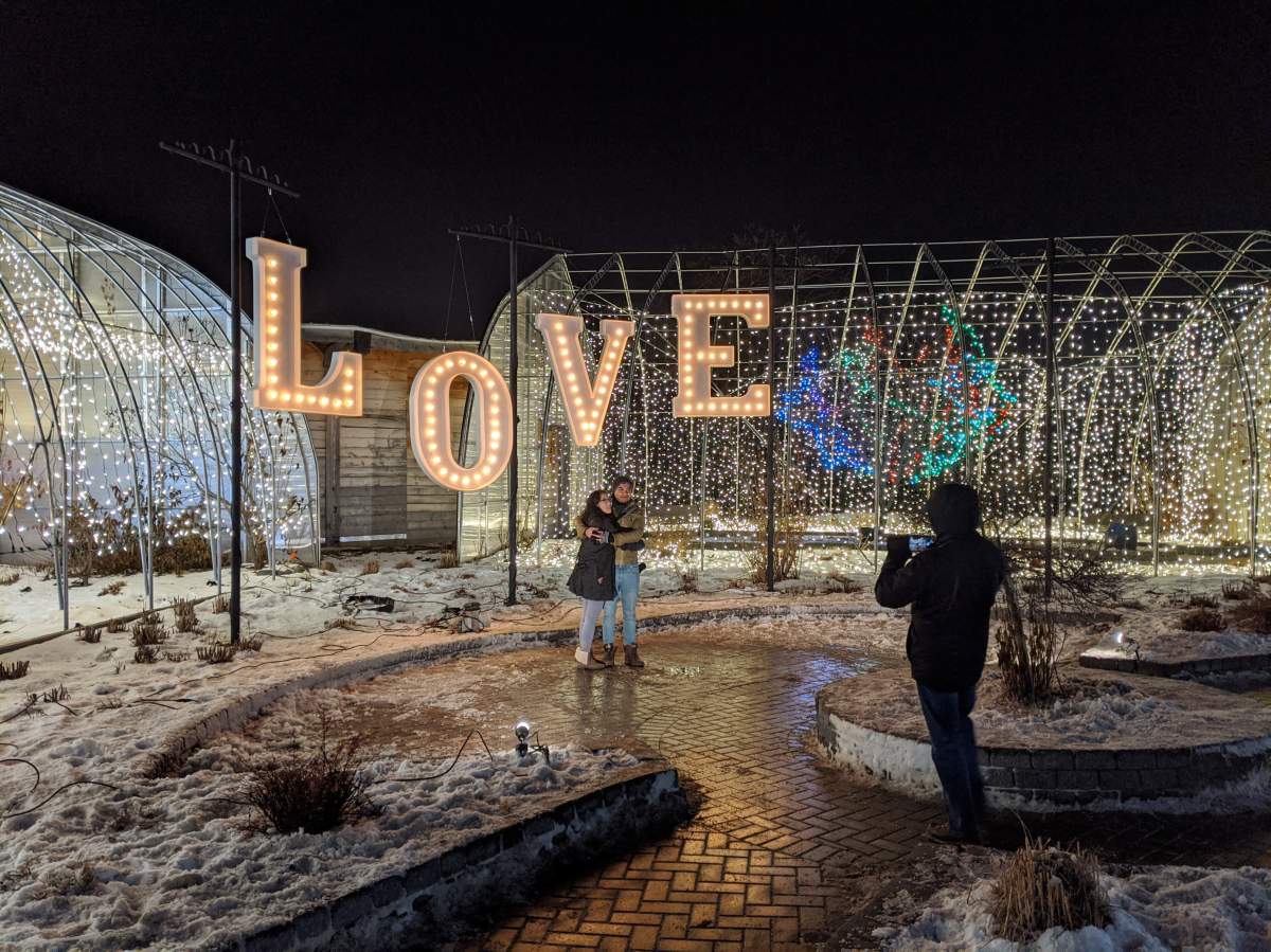 Zoo patrons pose for a photo at last year's Zoo Lights display.