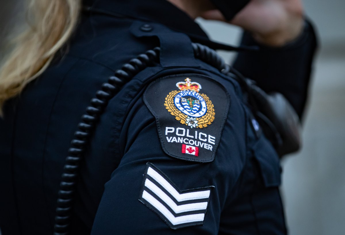 A Vancouver Police Department patch is seen on an officer's uniform as she makes a phone call after responding to an unknown incident in the Downtown Eastside of Vancouver, on Saturday, January 9, 2021. 