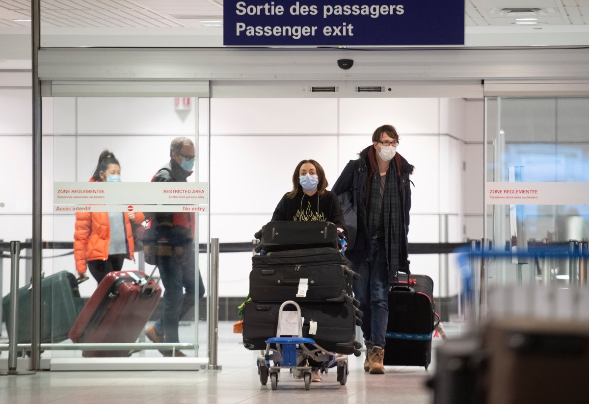 Passengers are shown in the international arrivals hall at Montreal-Trudeau Airport in Montreal, Tuesday, December 29, 2020, as the COVID-19 pandemic continues in Canada and around the world. 