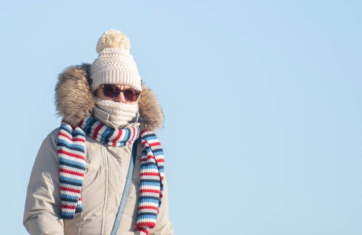 File photo of a woman braving the cold on Sunday, January 31, 2021. 