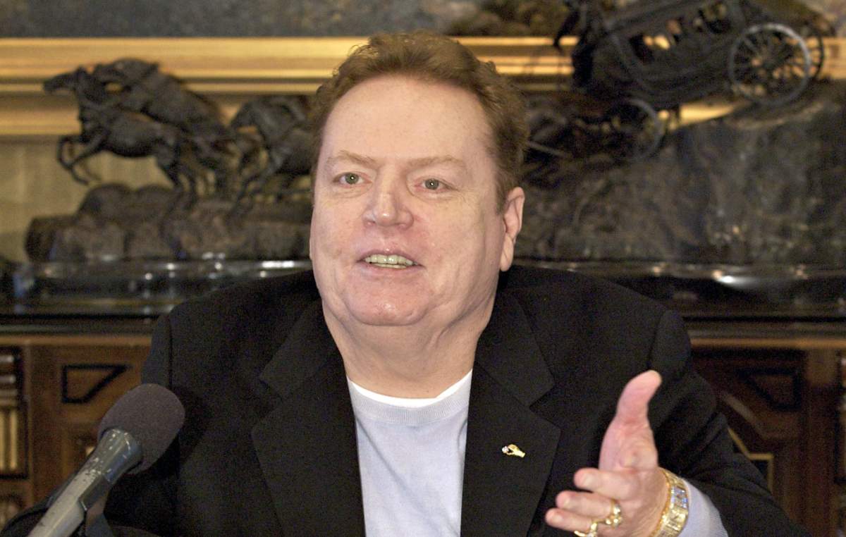 FILE - Larry Flynt Publications Inc. (LFP) Publisher Larry Flynt comments on the resignation of former New York Governor Eliot Spitzer, during an interview with The Associated Press in his office in Beverly Hills, Calif. on March 14, 2008. Flynt, who turned "Hustler" magazine into an adult entertainment empire while championing First Amendment rights, has died at age 78. His nephew, Jimmy Flynt Jr., told The Associated Press that Flynt died Wednesday, Feb. 10, 2021, of heart failure at his Hollywood Hills home in Los Angeles. (AP Photo/Damian Dovarganes, File).