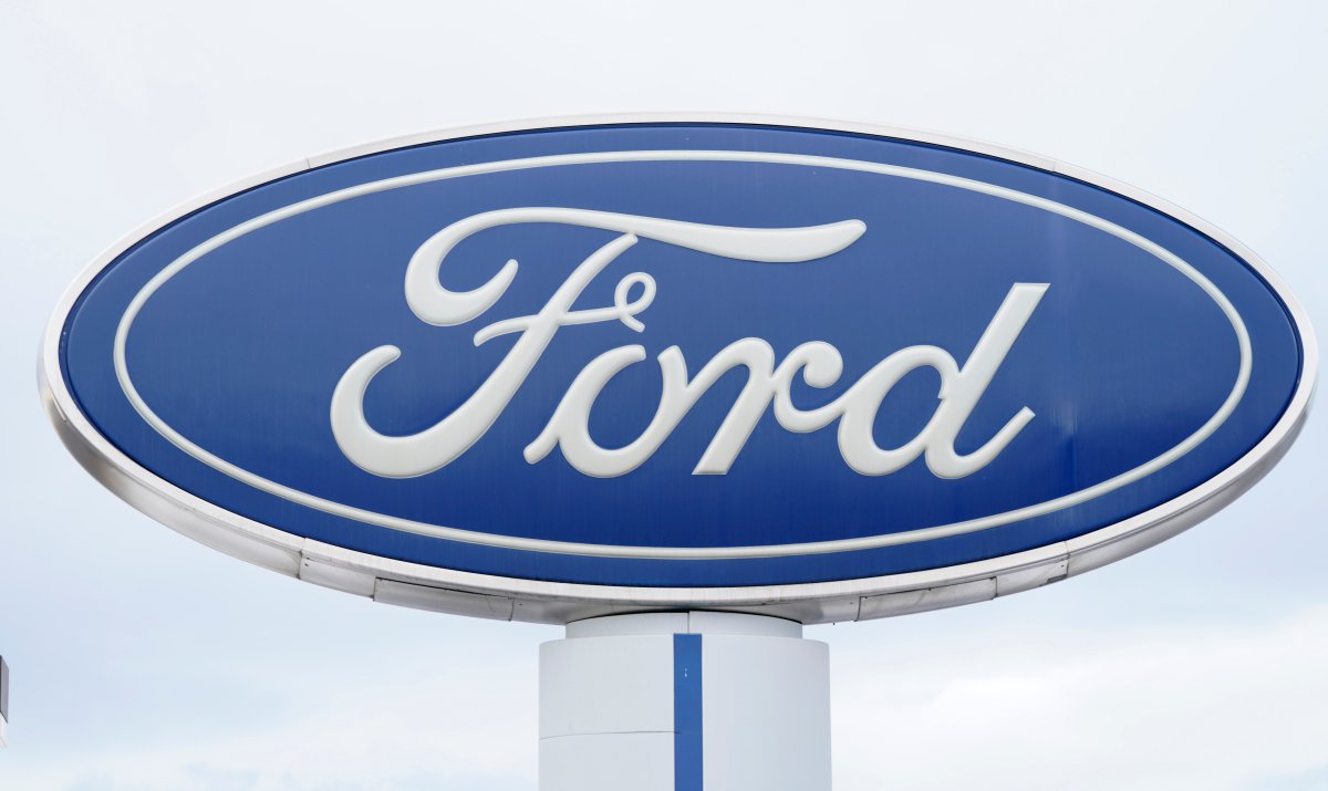 FILE - In this Sunday, Dec. 20, 2020, file photo, the company logo is viewed on a sign outside a Ford dealership, in Centennial, Colo.