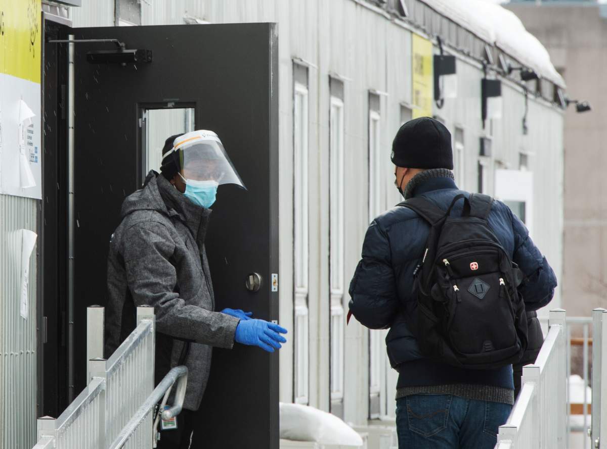 People line up to get tested at a COVID-19 clinic, Wednesday, February 24, 2021  in Montreal.