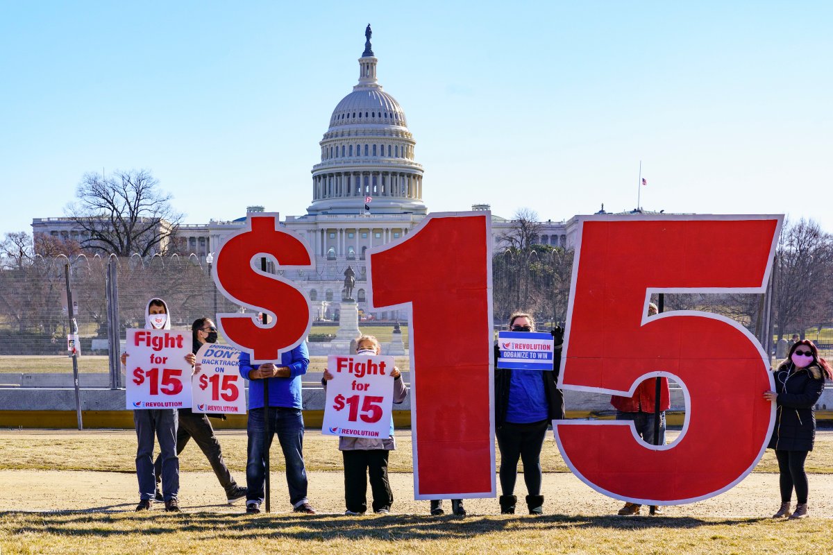 Activists appeal for a $15 minimum wage near the Capitol in Washington, Thursday, Feb. 25, 2021.