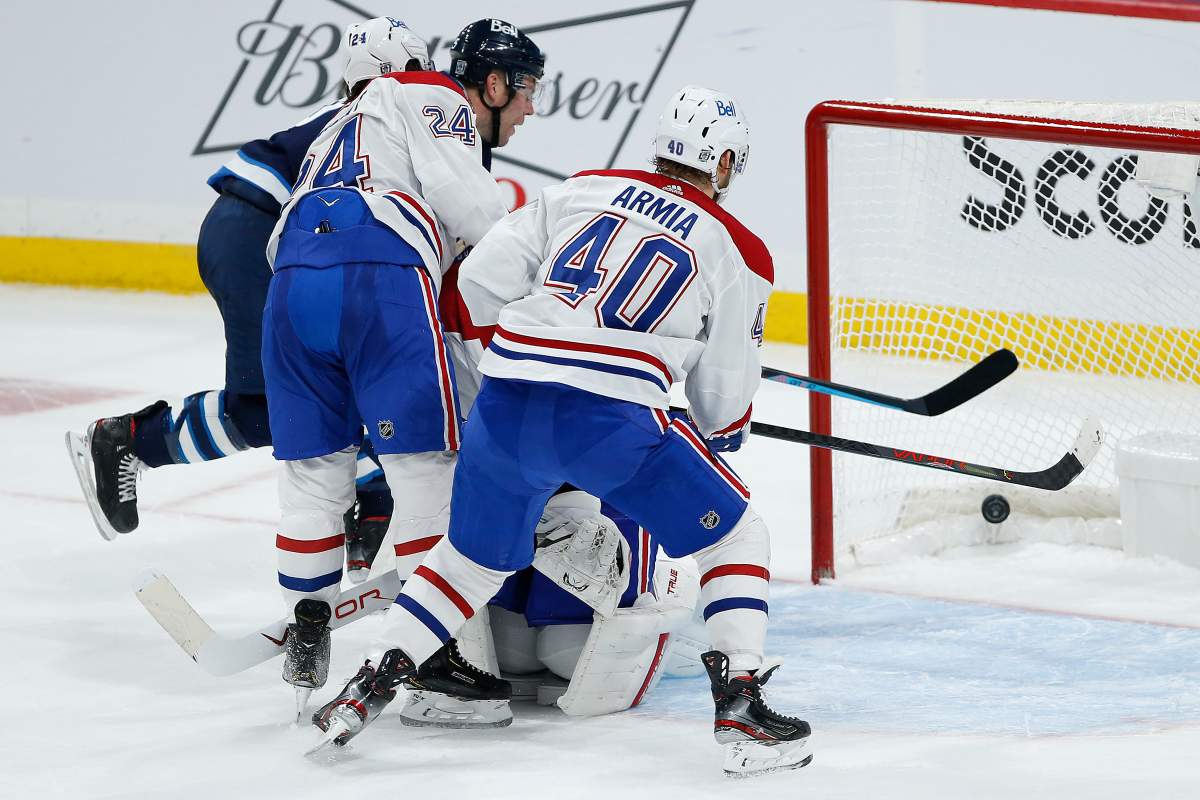 Winnipeg Jets' Paul Stastny (25) taps in the game winner past Montreal Canadiens goaltender Jake Allen (34) in overtime NHL action in Winnipeg on Saturday, February 27, 2021. THE CANADIAN PRESS/John Woods.