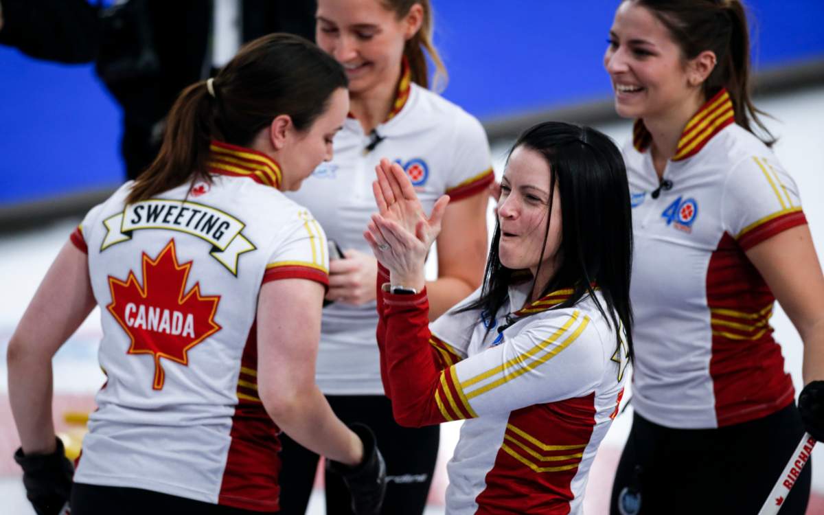 Team Canada skip Kerri Einarson, centre, celebrates after defeating Team Ontario in the final at the Scotties Tournament of Hearts in Calgary, Alta., Sunday, Feb. 28, 2021.
