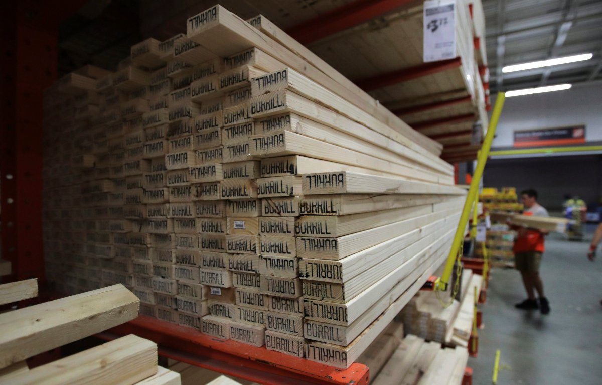 FILE - In this July 11, 2019, file photo lumber is stacked at the Home Depot store in Londonderry, N.H. 