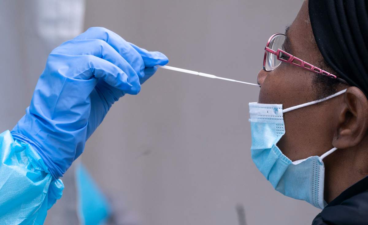 A woman is tested at a temporary COVID-19 test clinic in Montreal, on Friday, May 15, 2020. THE CANADIAN PRESS/Paul Chiasson.